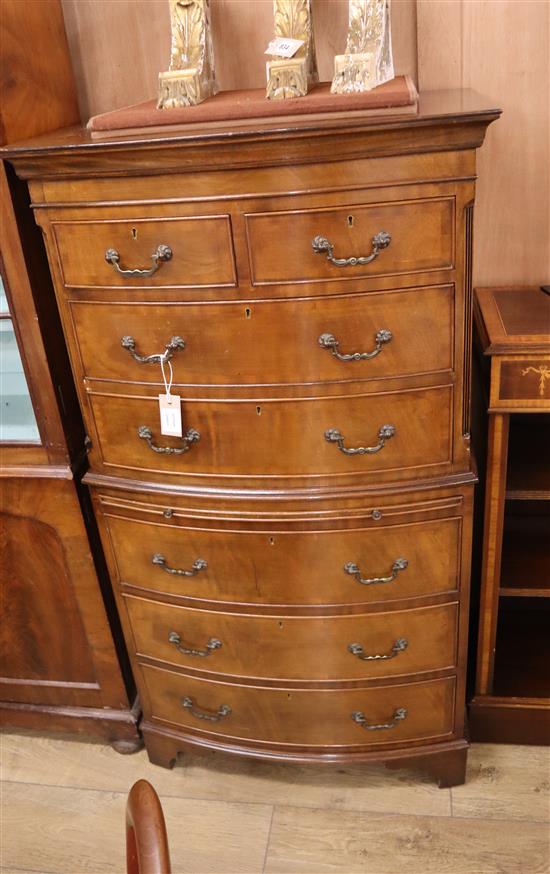 A George III style bow fronted walnut chest on chest W.72cm